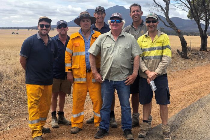 PHOTO: Wayne Davis (center), says they have been pushing for years to have a fire truck based near the popular tourist destination. (ABC Great Southern: Kit Mochan)