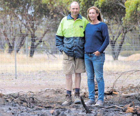 John and Margot Byrne near their boundary fence. Picture: Liam Croy