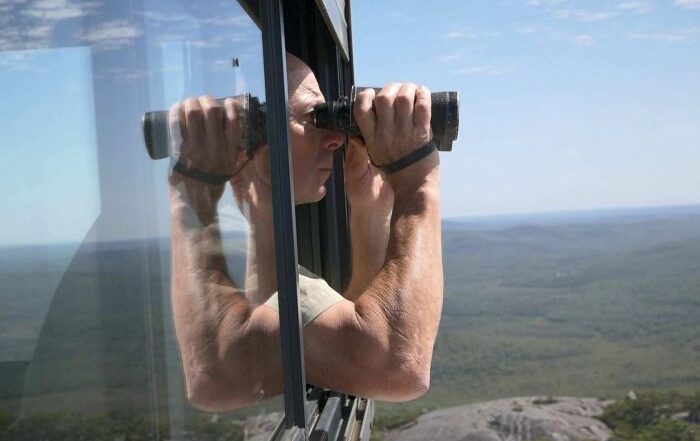 PHOTO: No time for reading anything except the landscape: an observer scans the WA wilderness for smoke. (ABC South West WA: Mark Bennett)