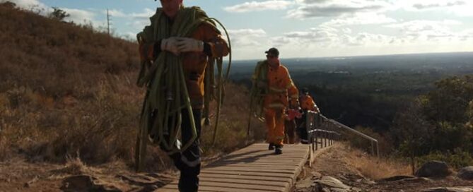 Kalamunda Volunteer Bush Fire Brigade members cleaning up after a dangerous fire at Lesmurdie Falls in Western Australia in January 2020