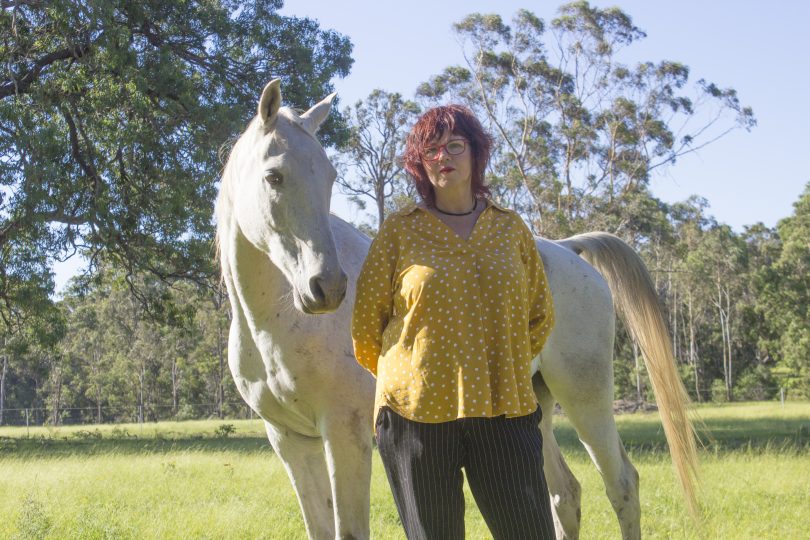 Jo Dodds and her horse, Raf, at home in Tathra on the NSW South Coast. Photo: Supplied.